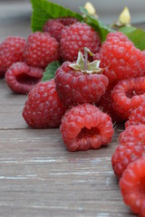 fresh raspberries on wooden table