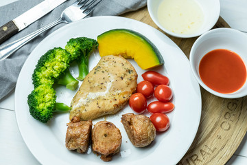 chicken steak with potatoes and vegetables