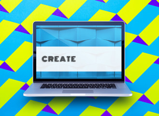 Computer staying on a table & showing the screen. Trendy & vibrant design. Geometry. Innovational digital internet applications & web business solutions. Modern workspace in an office. Development.