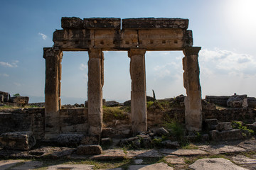 Fototapeta na wymiar Turkey: building on Frontinus Street, the main street to the Roman city of Hierapolis (Holy City), ancient city located on hot springs in classical Phrygia whose ruins are near Pamukkale