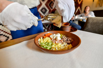 cooking olivier mixing in a large dish