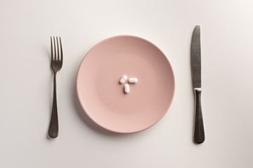 Pills on a plate. Flat lay.