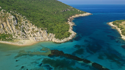 Fototapeta na wymiar Aerial drone photo of iconic secluded sandy beach with emerald sea in island of Sfaktiria next to bay and famous beach of Divari (chrysi akti), Messinia, Gialova, Peloponnese, Greece