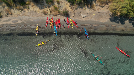 Aerial drone photo of colourful sport canoes operated by young athletes competing in Mediterranean bay with crystal clear turquoise sea