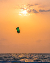 Sunset and kite surfing on the beach of Cartagena, Colombia