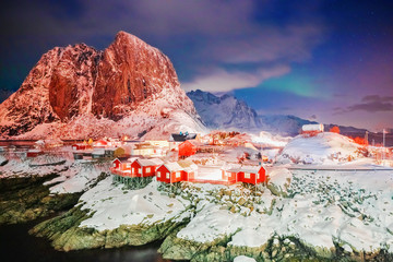 Lofoten Island Archipelago, beautiful village Hamnoy - red wooden rorbu, traditional house on...