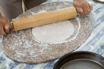 female hands kneading Pizza dough
