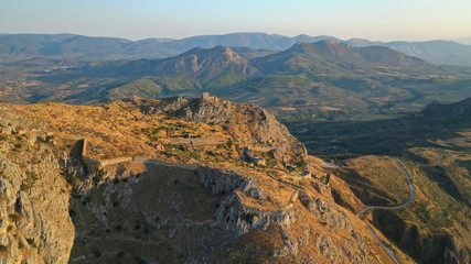 Aerial drone panoramic view of iconic uphill medieval castle of Acrocorinth an ancient citadel overlooking ancient Corinth, Peloponnese, Greece