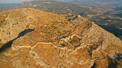 Aerial drone panoramic view of iconic uphill medieval castle of Acrocorinth an ancient citadel...