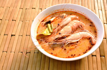 boiled shrimp with herb in Thai spicy soup or tom yum kung on bowl
