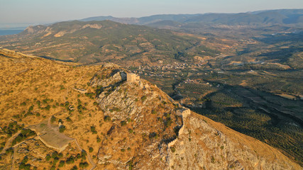 Aerial drone panoramic view of iconic uphill medieval castle of Acrocorinth an ancient citadel...