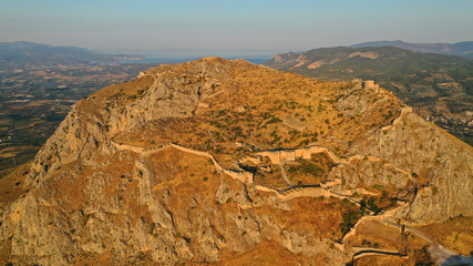 Aerial drone panoramic view of iconic uphill medieval castle of Acrocorinth an ancient citadel...