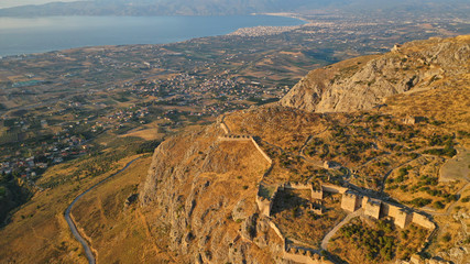 Aerial drone panoramic view of iconic uphill medieval castle of Acrocorinth an ancient citadel...