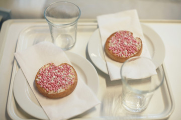celebration the birth of a daughter with Dutch crispy biscuit with pink sugared aniseed balls