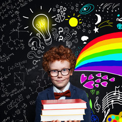 Cute kid in glasses portrait on science and arts background