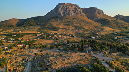 Aerial drone photo of iconic archaeological site of Ancient Corinth featuring temple of Apollo...
