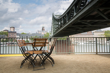 Eiserner Steg Bridge with Cafe Table and Chair; Frankfurt