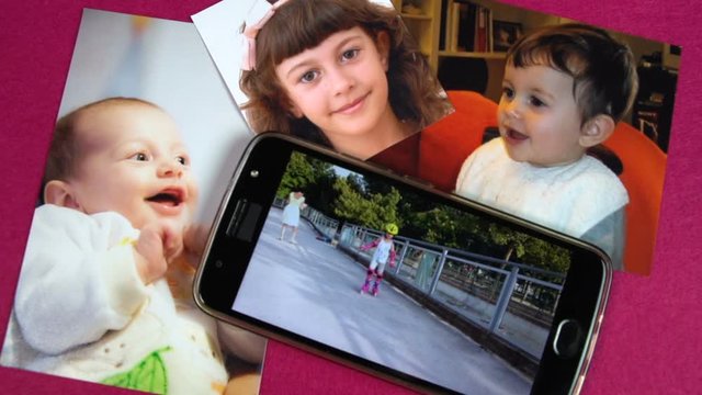 Baby and child photos are on a purple background while video of a female chid on roller blades is running on mobile FDV