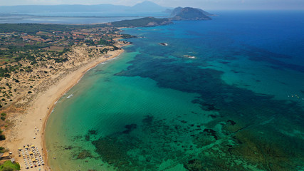 Fototapeta na wymiar Aerial drone photo of iconic sandy beach of Amolofoi next to sandy bay of Navarino with crystal clear turquoise sea, Messinia, Peloponnese, Greece