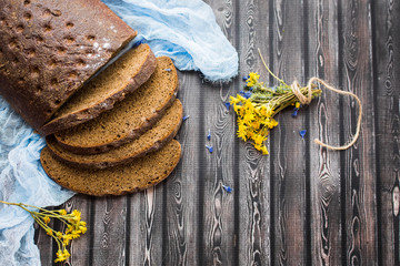 Fresh bread, homemade pastry on wooden background. Food, vegetarian healthy food concept