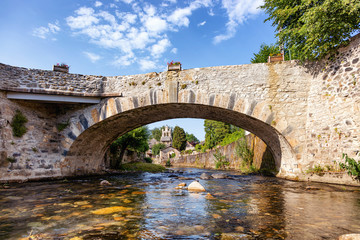 Obraz premium View of the river bridge and the village church Audressein in the department of Ariège, in the Pyrenees, Occitanie region, France