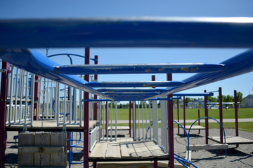 Fototapeta na wymiar Colourful playground monkey bars in school yard.