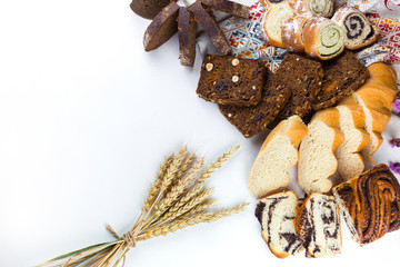 Various kinds of fresh bread, cake, homemade pastry on white isolated background. Food, vegetarian...