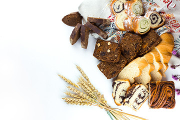 Various kinds of fresh bread, cake, homemade pastry on white isolated background. Food, vegetarian healthy food concept