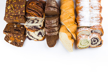 Various kinds of fresh bread, cake, homemade pastry on white isolated background. Food, vegetarian healthy food concept