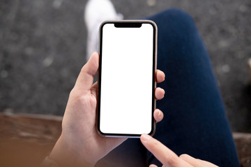 woman using Smartphone. Blank screen mobile phone for graphic display montage.networking service..