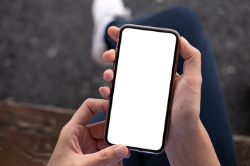 woman using Smartphone. Blank screen mobile phone for graphic display montage.networking service..