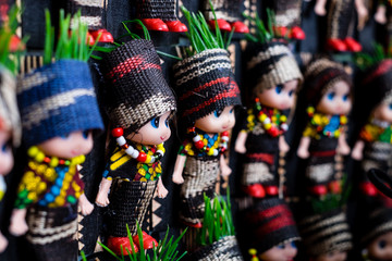 Koronadal, PH - July 18, 2019: Cute dolls dressed in T'nalak clothes displayed during the T'nalak Festival 2019.  T'nalak cloth is handwoven and made from organic Abaca plant fibers, thus, animal free