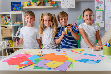 Creative projects with children at home or at school. Kids making some paper crafts. 