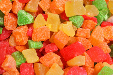 Colored candied fruit background, texture, closeup