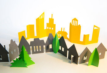 Little town houses in raw. City, property and house buying concept. Paper cut design background.