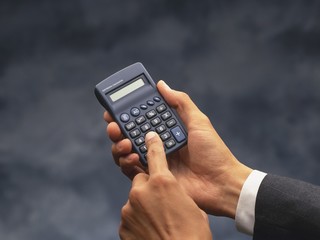 calculator in hand