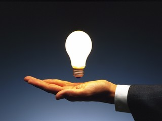 hand holding light bulb