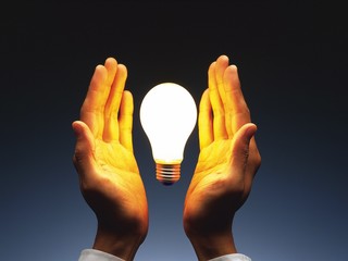 hand holding light bulb