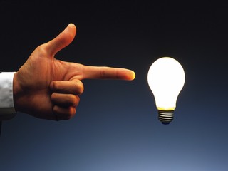 hand holding light bulb