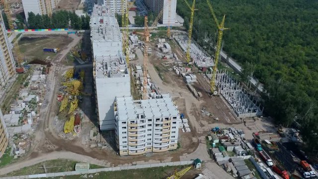 Modern building under construction with crane. building with a high crane