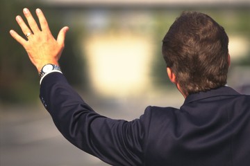 man with arms raised