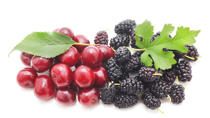 Red ripe cherries with mulberry.