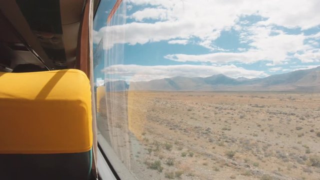 Bus traveling on the Patagonia steppe, view from the window of the Patagonian landscape. 4k