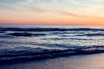 Obraz premium A sunset on the beach. Sea and eveninig sky with clouds