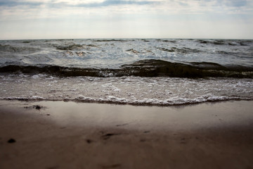 A sunset on the beach. Sea and eveninig sky with clouds