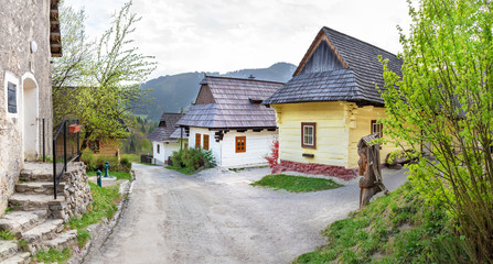 Fototapeta na wymiar Colourful traditional wooden houses in mountain village Vlkolinec- UNESCO (SLOVAKIA)