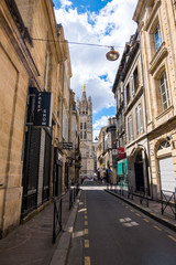 A narrow street with old residential buildings in the historical center of Bordeaux, France