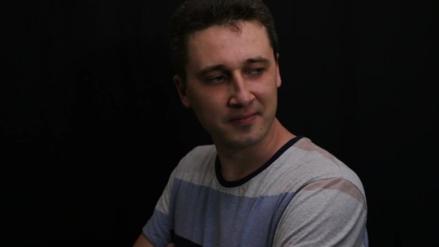 unhappy young handsome caucasian man shows his emotion close-up