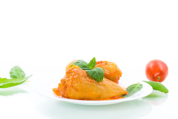 stuffed pepper with meat and vegetable sauce in a plate