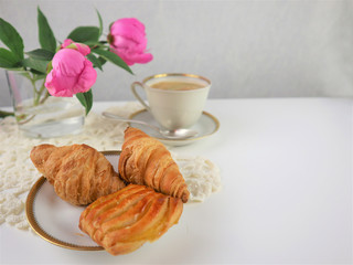 breakfast with cup of coffee and croissants